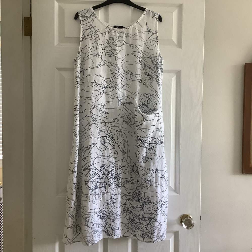 Woman’s sleeveless linen dress by “Fenini”.
